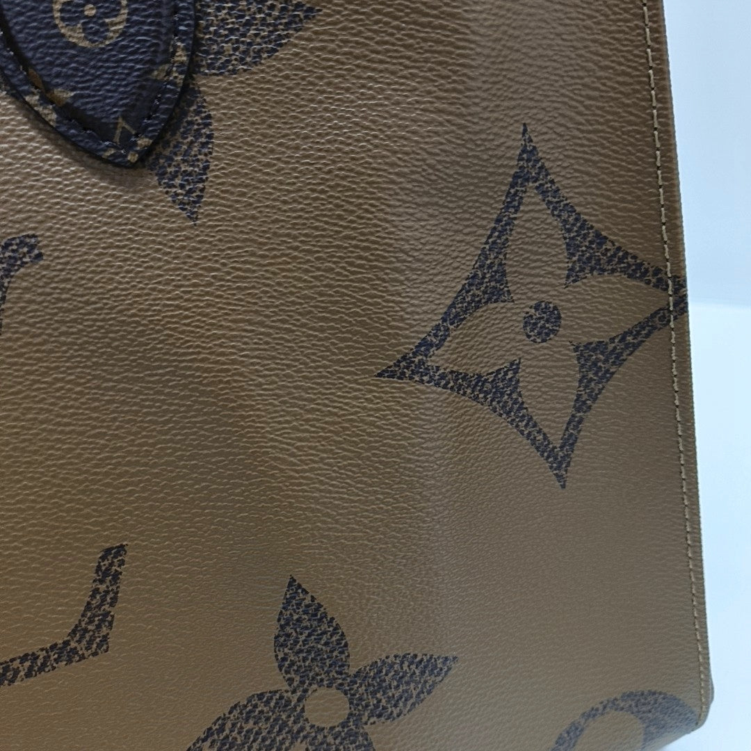 ONTHEGO MM Monogram Coated Canvas Brown