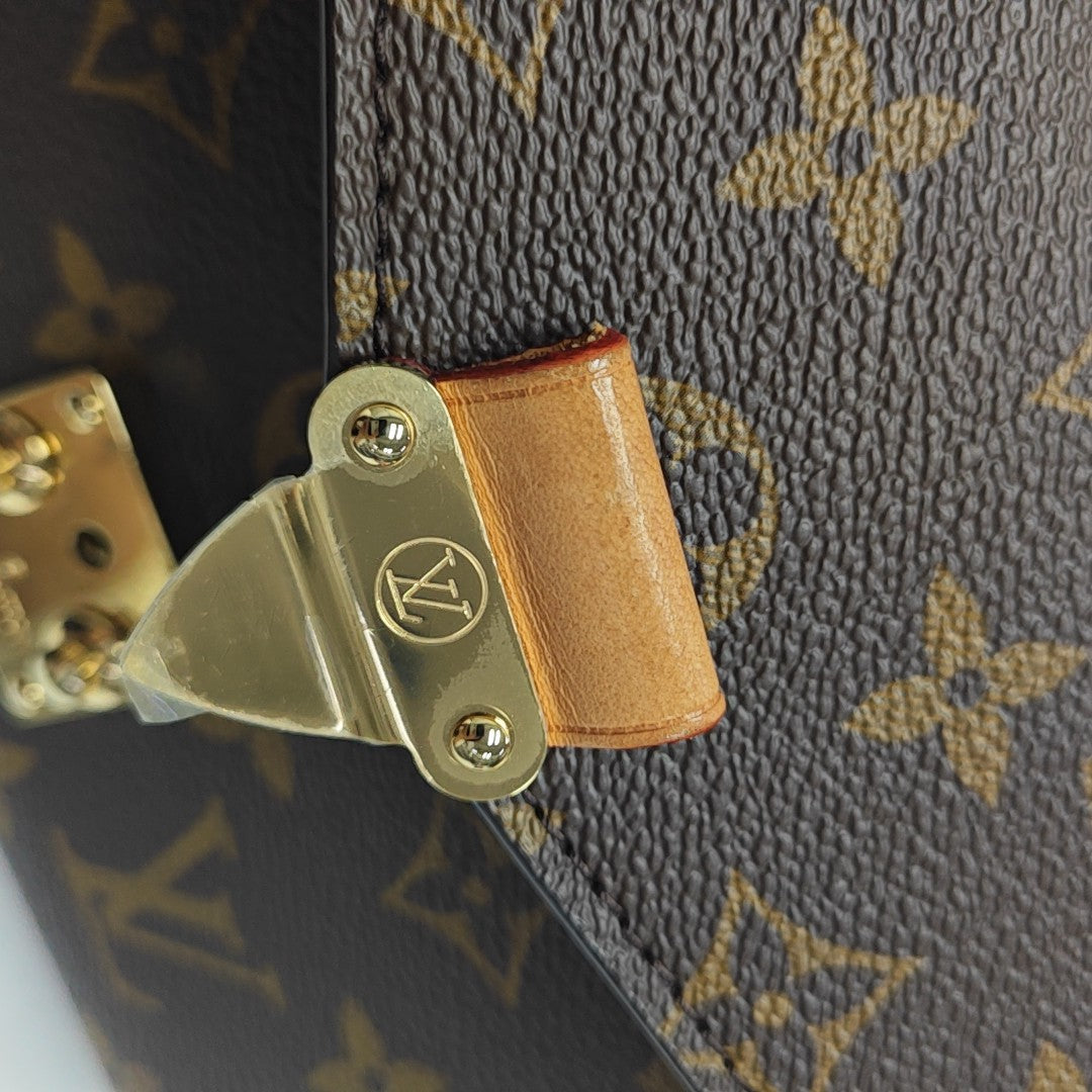 MÉTIS EAST WEST Monogram Coated Canvas Brown