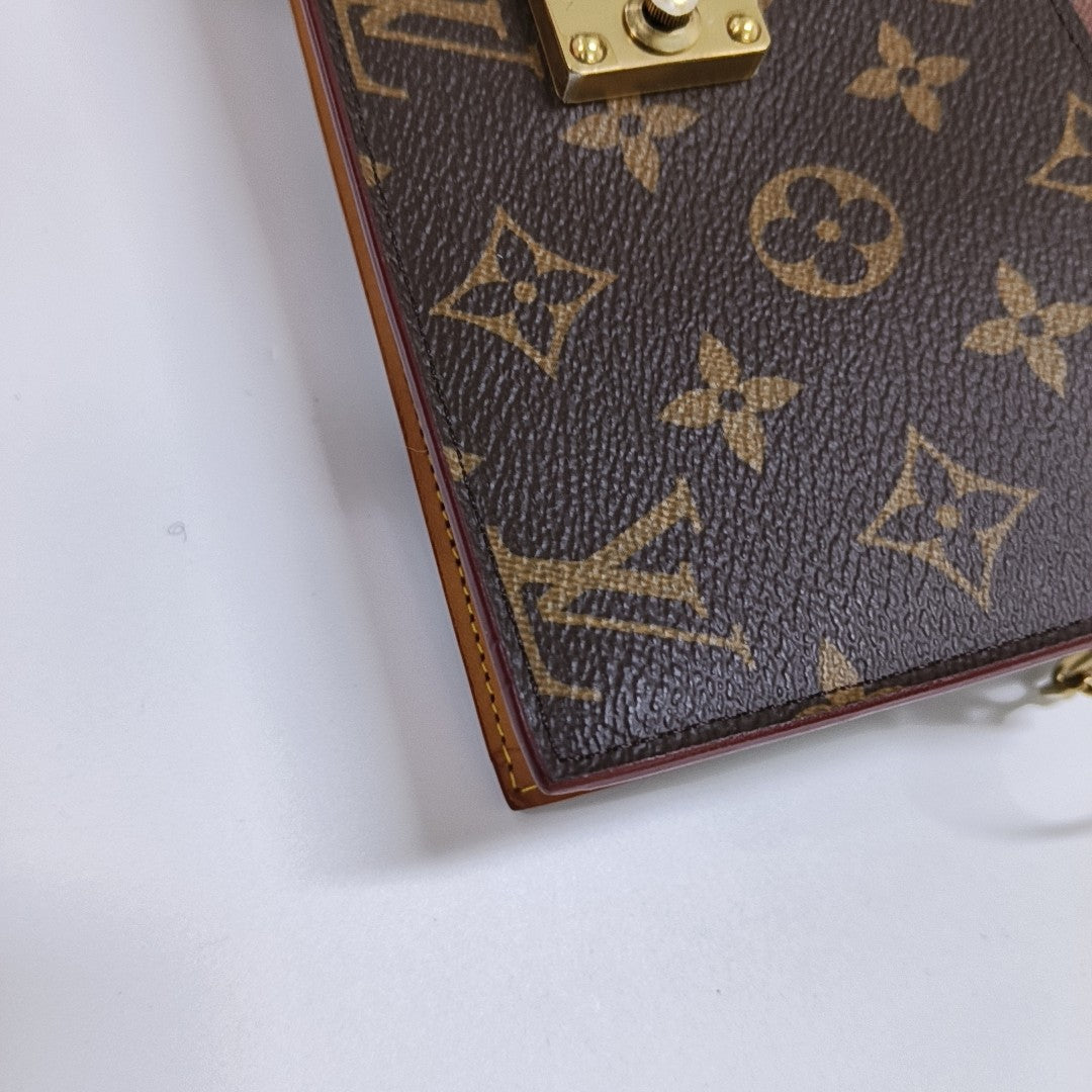 S LOCK Monogram Coated Canvas Brown