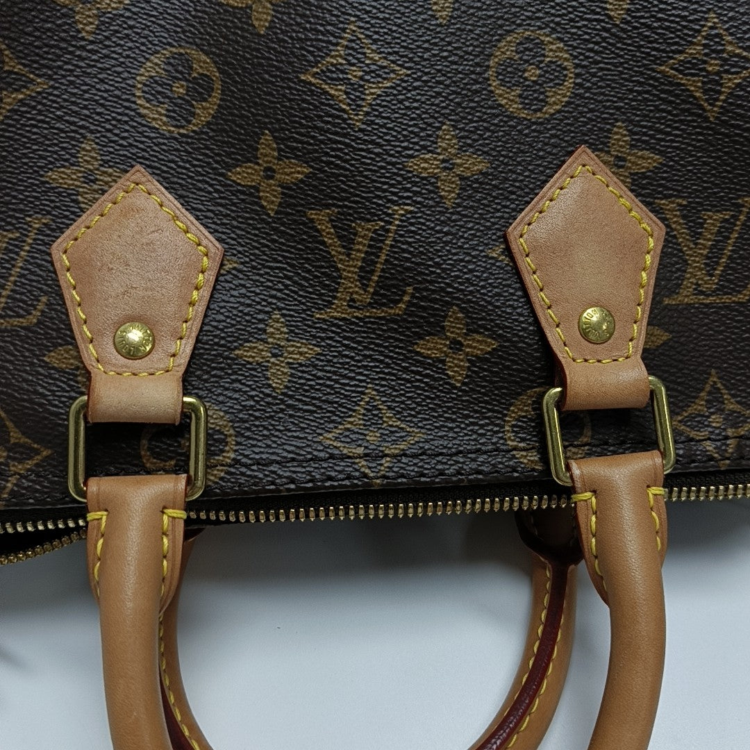 SPEEDY 25 Monogram Coated Canvas Brown