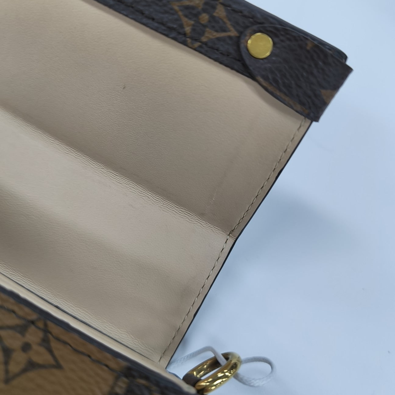 TRUNK Monogram Coated Canvas Brown