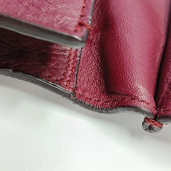 Authenticated pre-owned  Papier Calfskin Burgundy - Clutch at Looply