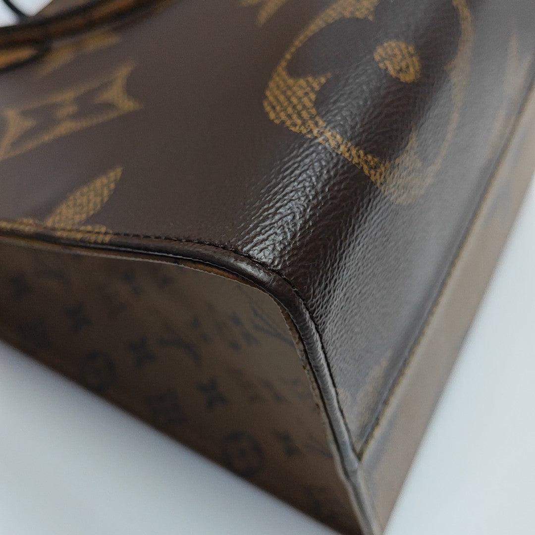 ONTHEGO GM Monogram Coated Canvas Brown