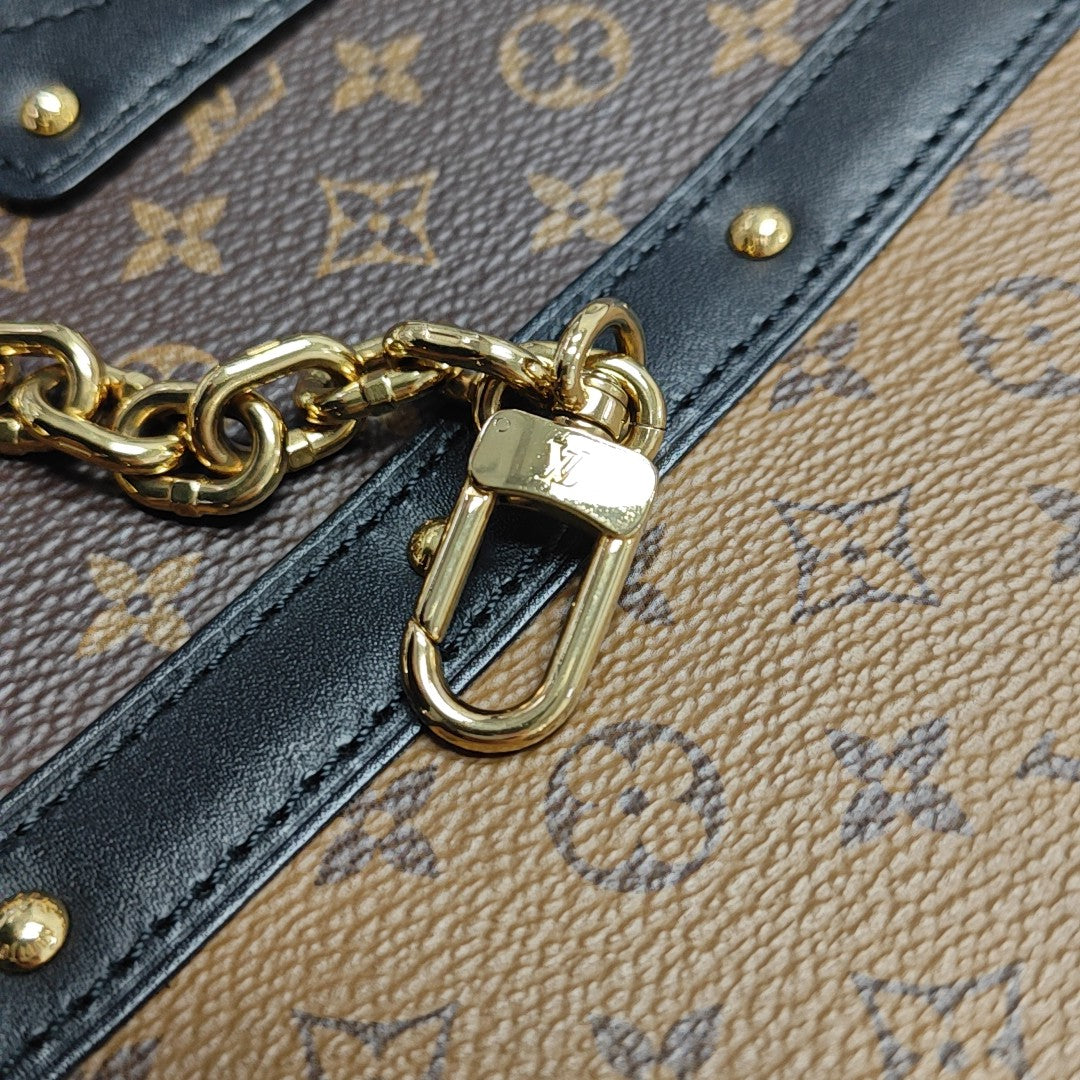 TRUNK Monogram Coated Canvas Brown