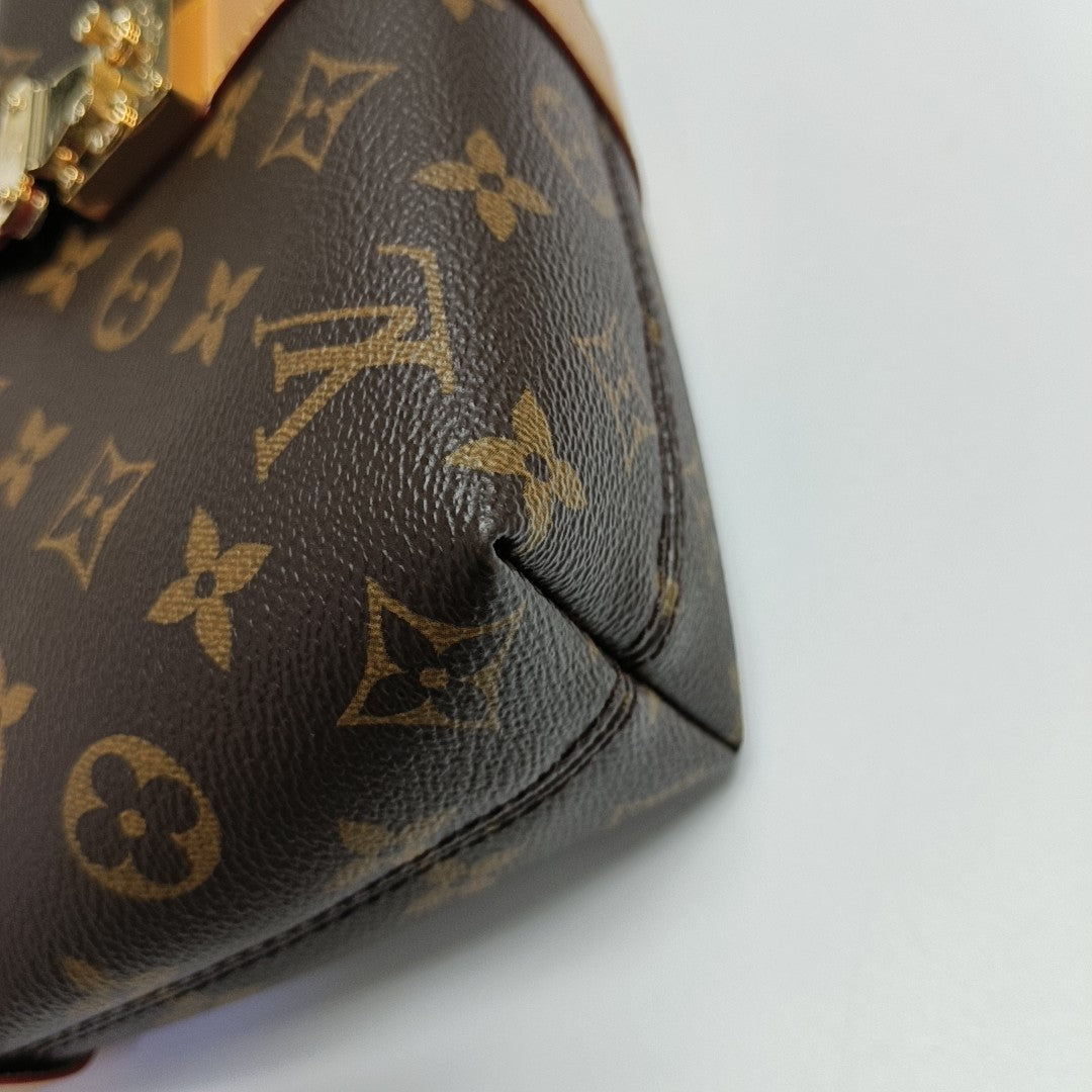 Pochette Mia Monogram Coated Canvas Brown