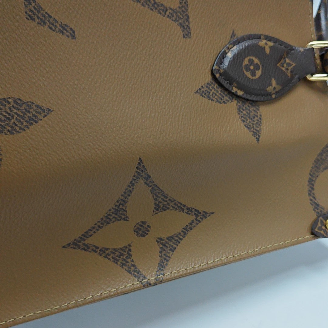 ONTHEGO MM Monogram Coated Canvas Brown