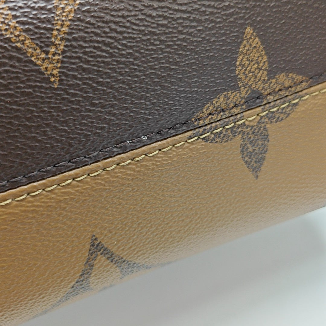 ONTHEGO PM Monogram Coated Canvas Brown