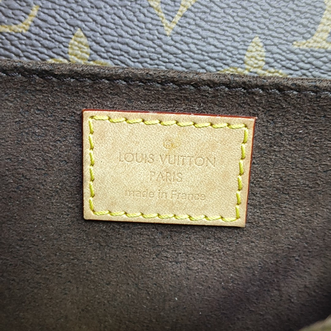 MÉTIS EAST WEST Monogram Coated Canvas Brown