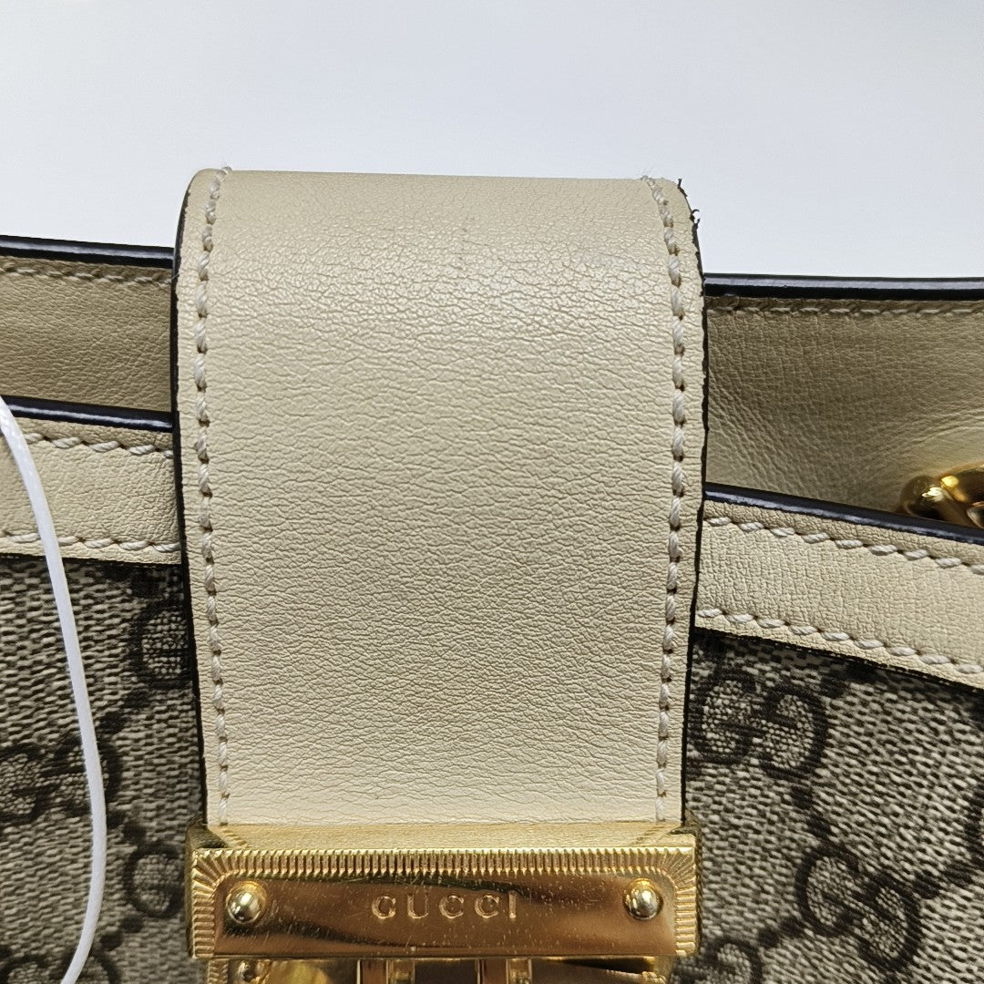 Padlock Small Monogram Coated Canvas Beige