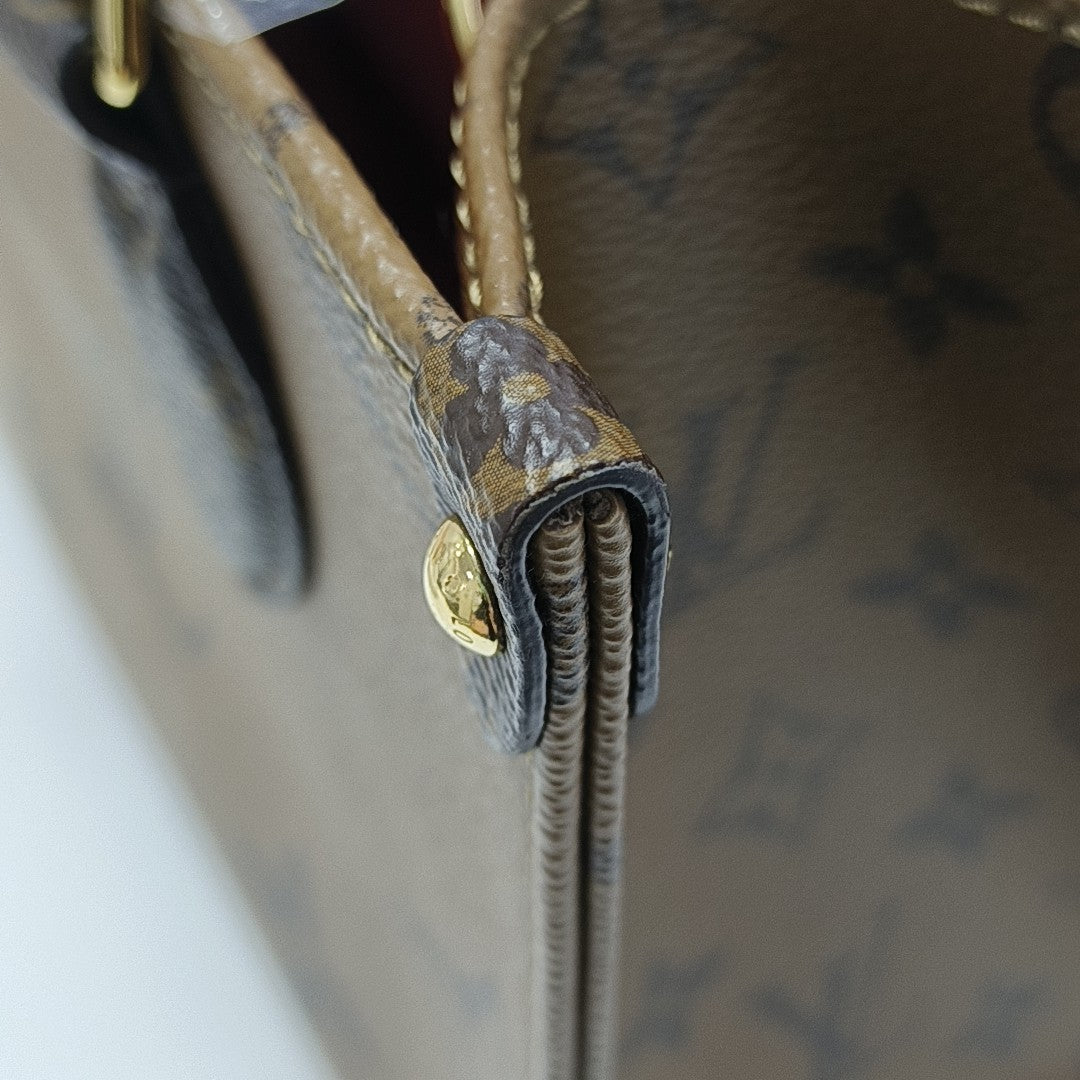 ONTHEGO PM Monogram Coated Canvas Brown