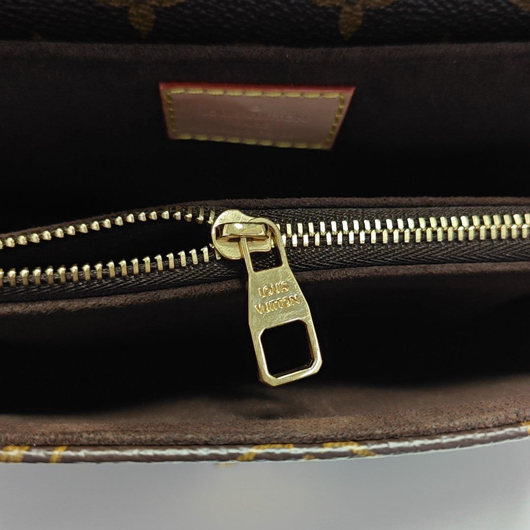 MÉTIS EAST WEST Monogram Coated Canvas Brown