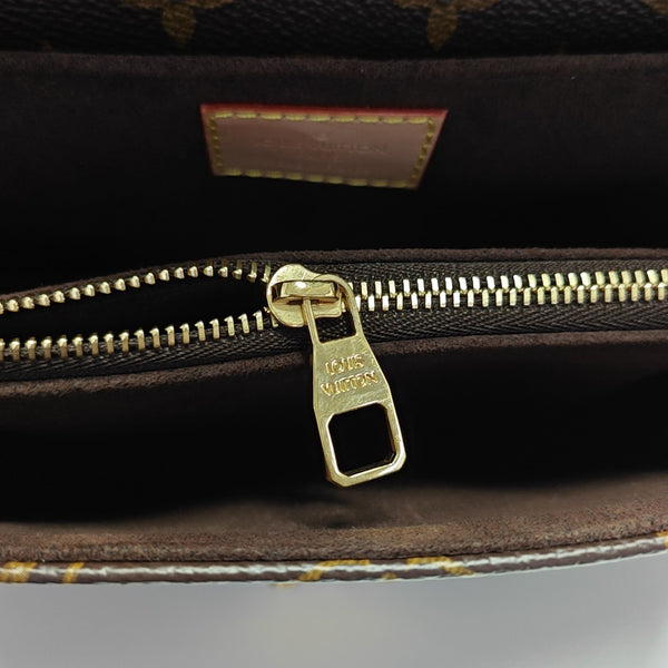 MÉTIS EAST WEST Monogram Coated Canvas Brown