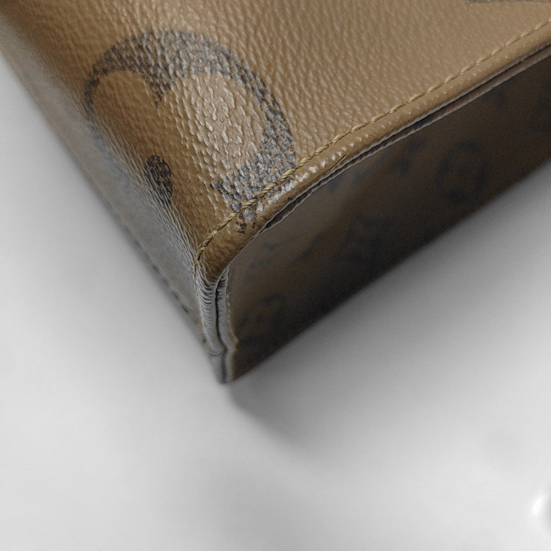 ONTHEGO PM Monogram Coated Canvas Brown