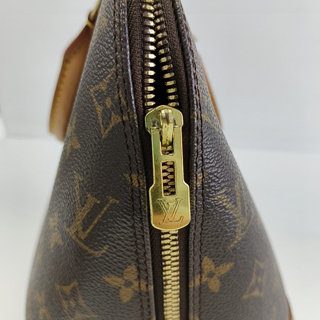 ALMA PM Monogram Coated Canvas Brown