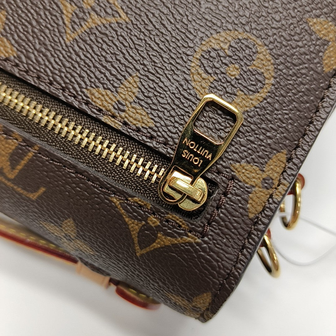 MÉTIS EAST WEST Monogram Coated Canvas Brown