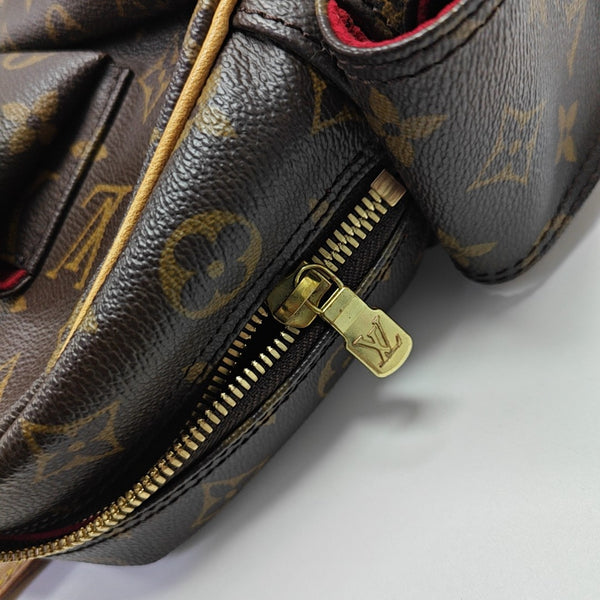 EXCENTRI-CITE Monogram Coated Canvas Brown