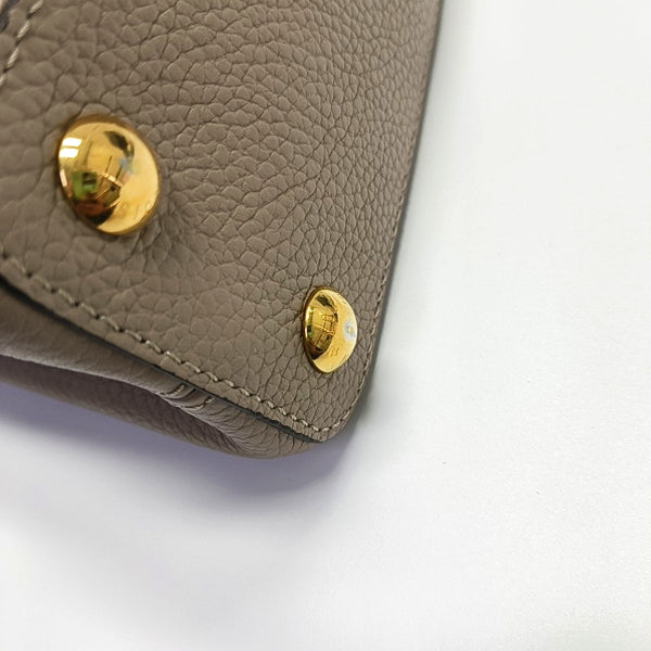 Authenticated pre-owned  CAPUCINES BB Calfskin Grey - Shoulder Bag at Looply