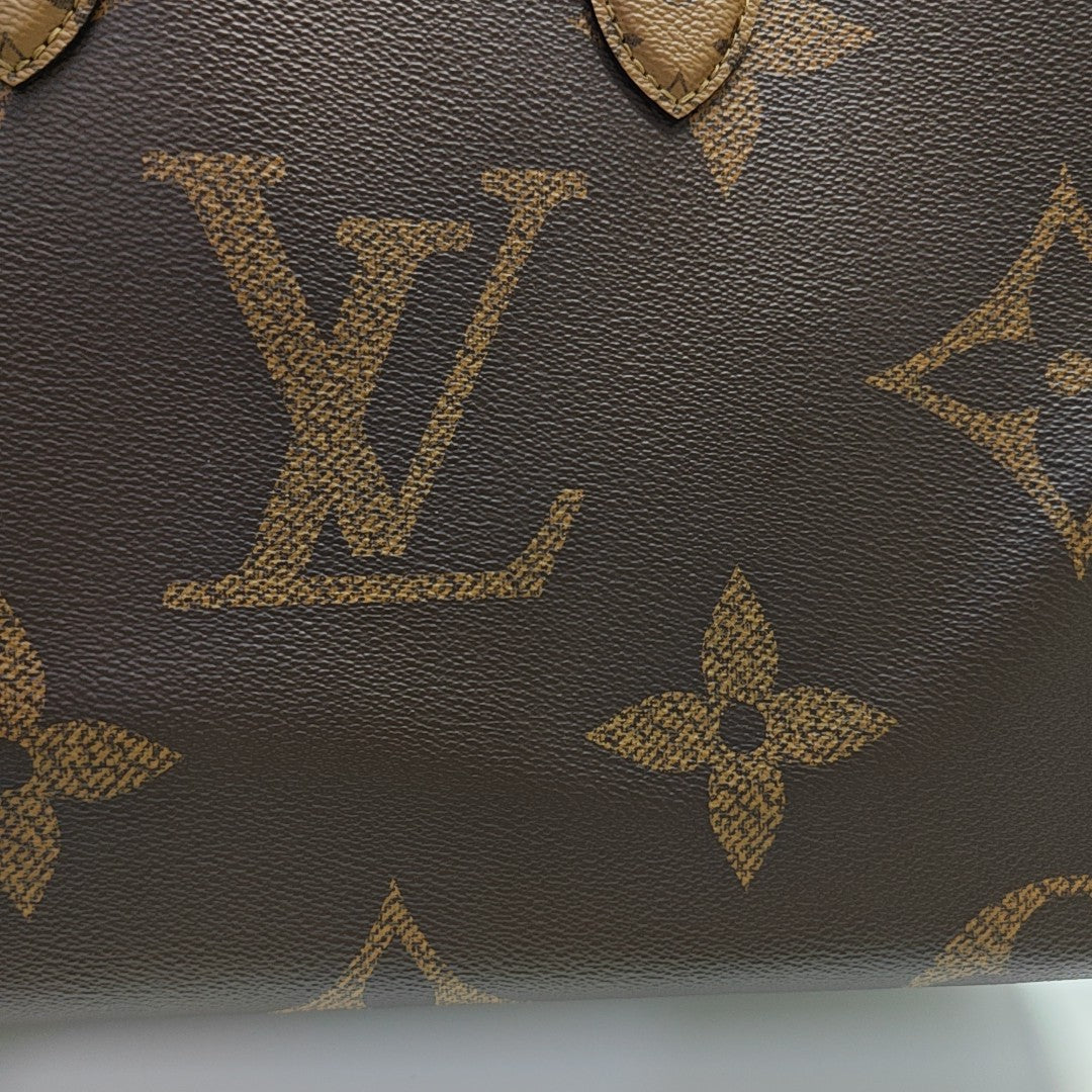 ONTHEGO MM Monogram Coated Canvas Brown