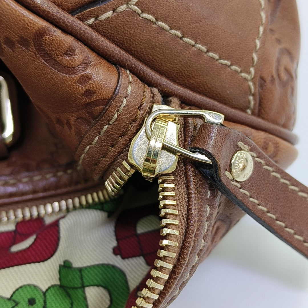 Joy Medium Monogram Calfskin Brown