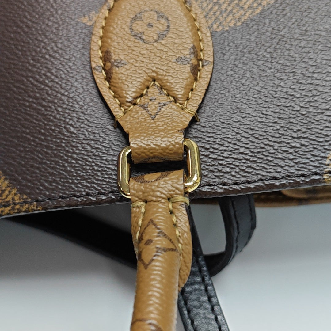 ONTHEGO MM Monogram Coated Canvas Brown