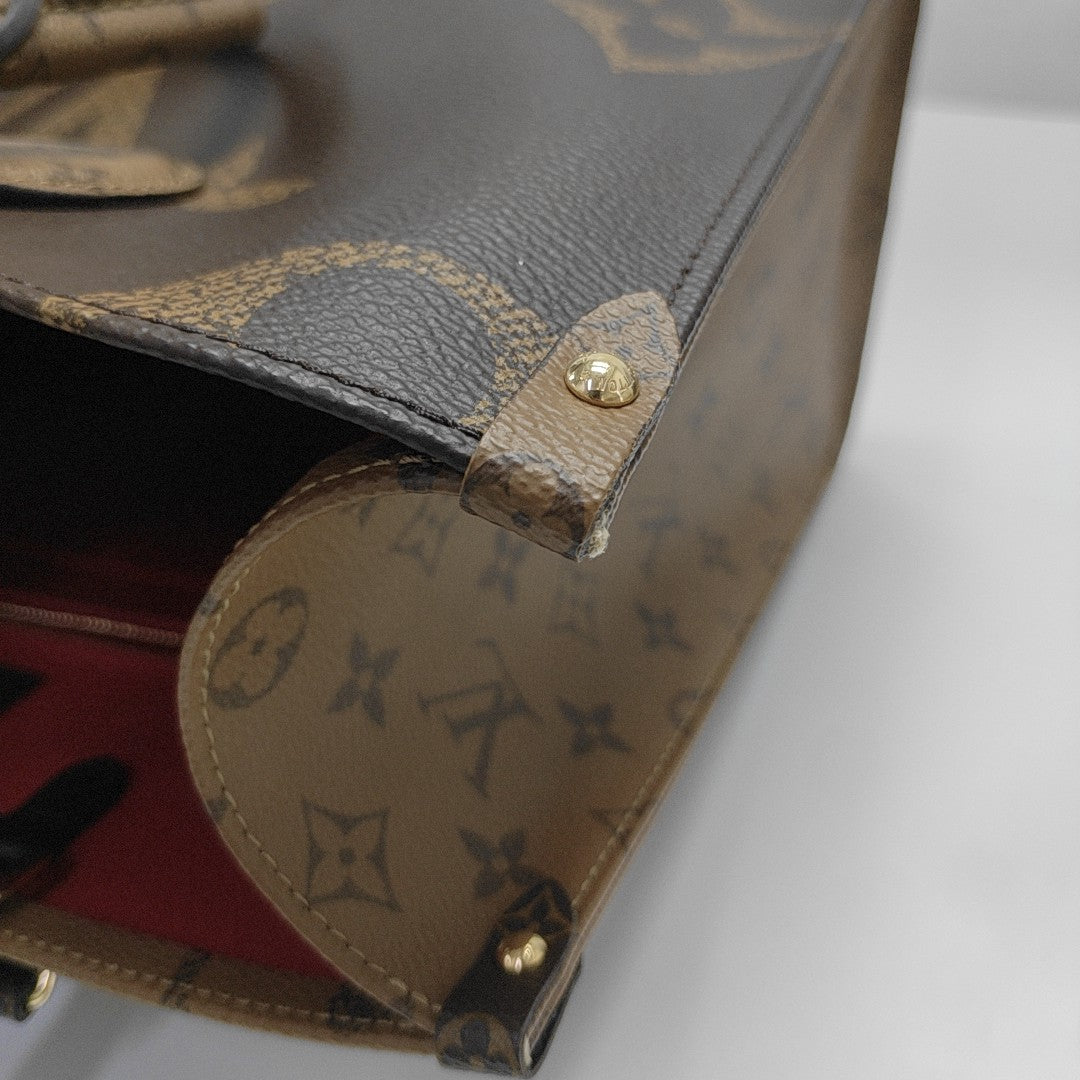 ONTHEGO MM Monogram Coated Canvas Brown
