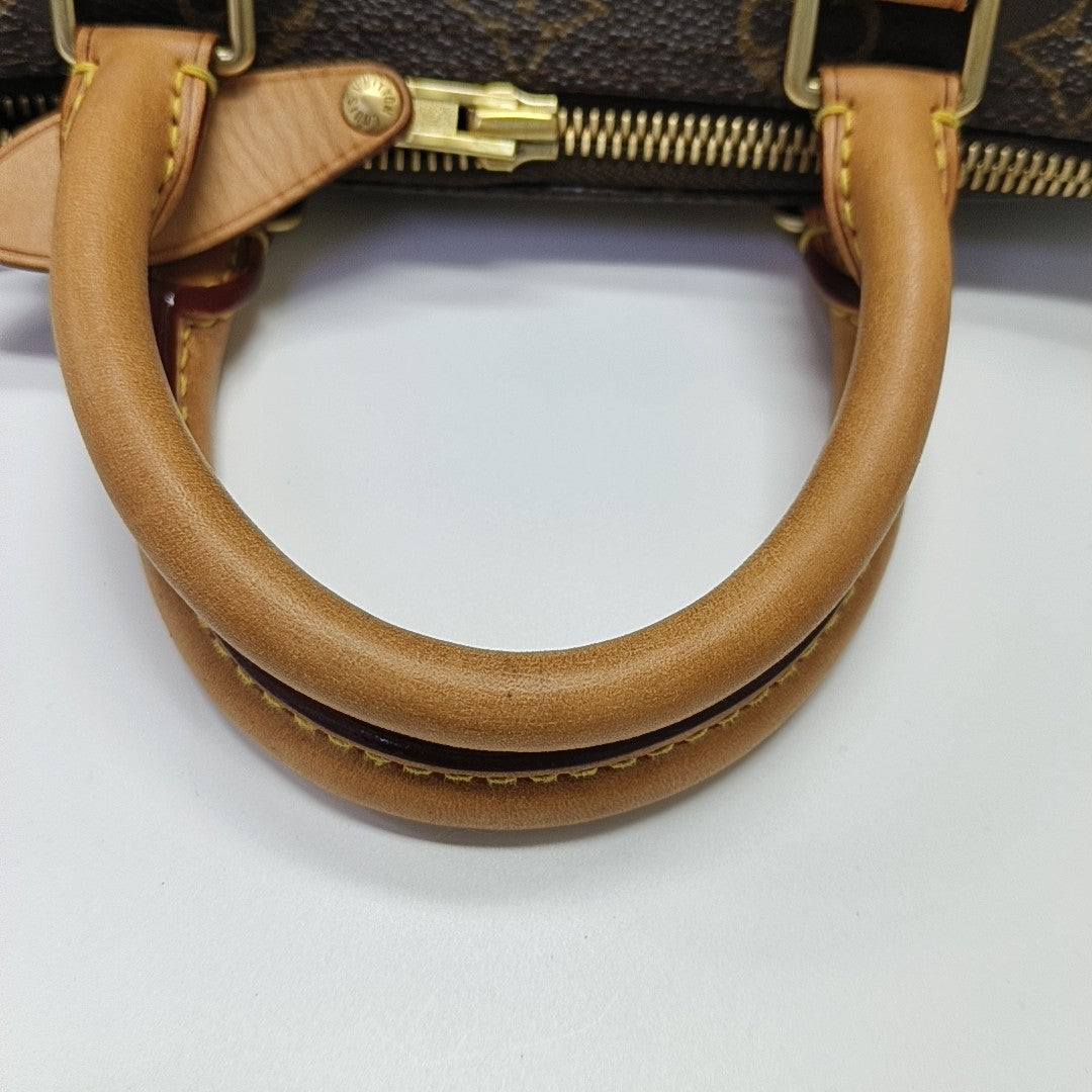 SPEEDY 25 Monogram Coated Canvas Brown