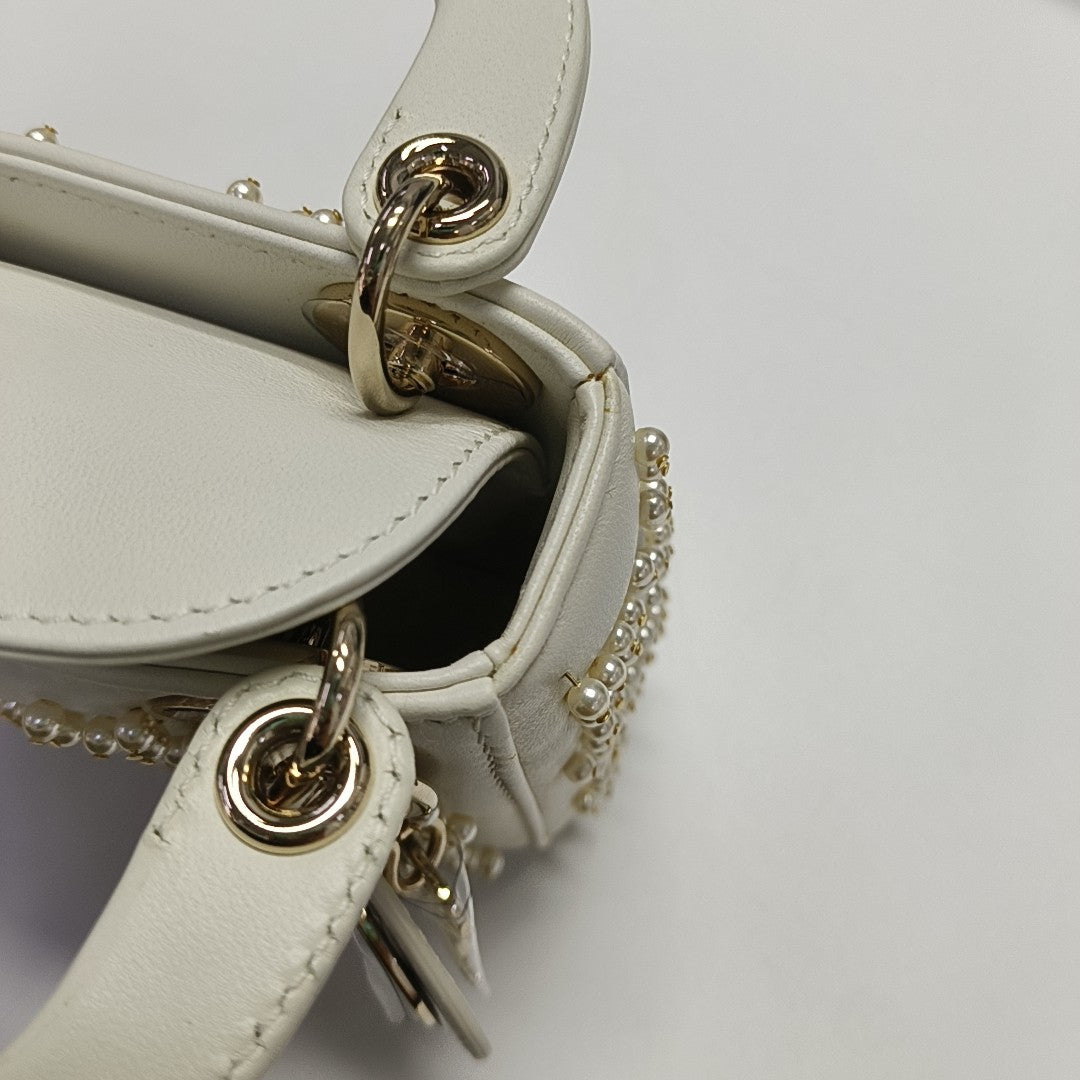 Authenticated pre-owned  Lady Dior Super Mini Quilted Lambskin White - Tote Bag at Looply