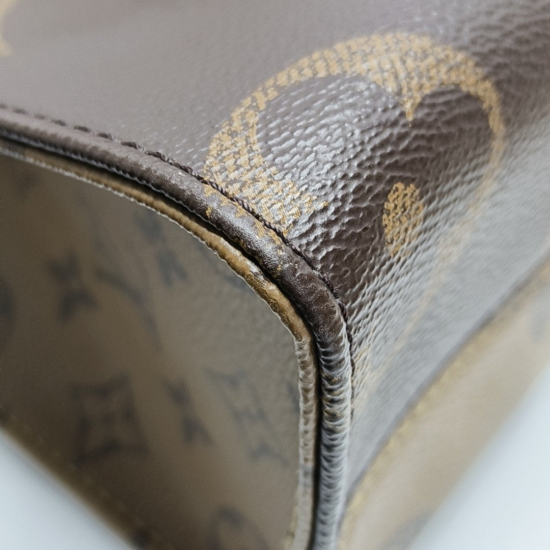 ONTHEGO PM Monogram Coated Canvas Brown