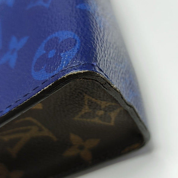 Pochette Voyag MM Monogram Coated Canvas Blue