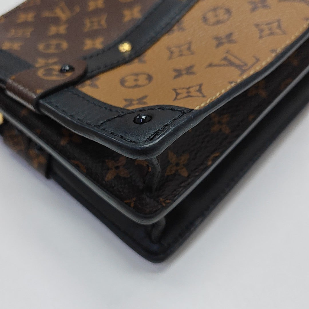TRUNK Monogram Coated Canvas Brown