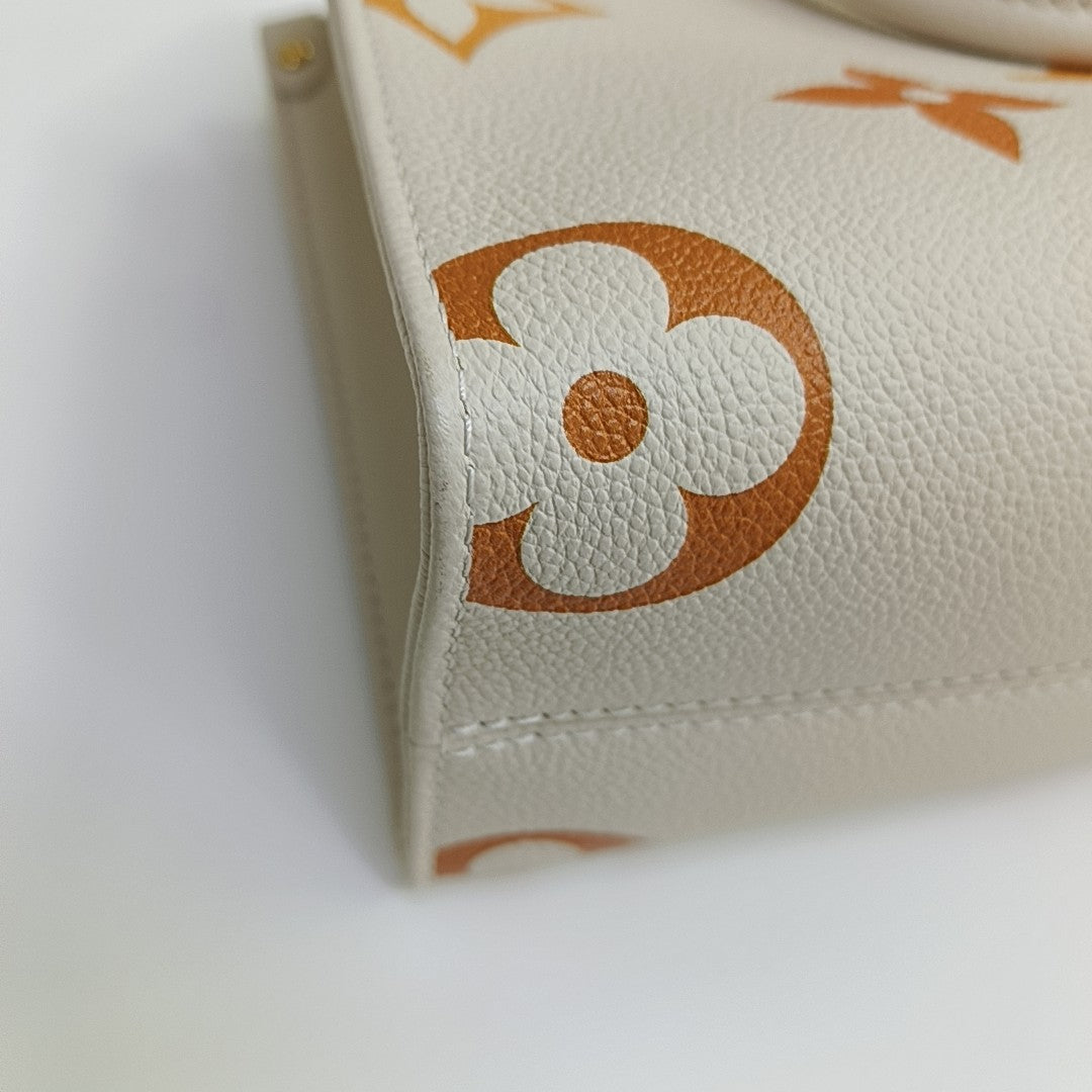 ONTHEGO PM Monogram Calfskin Beige