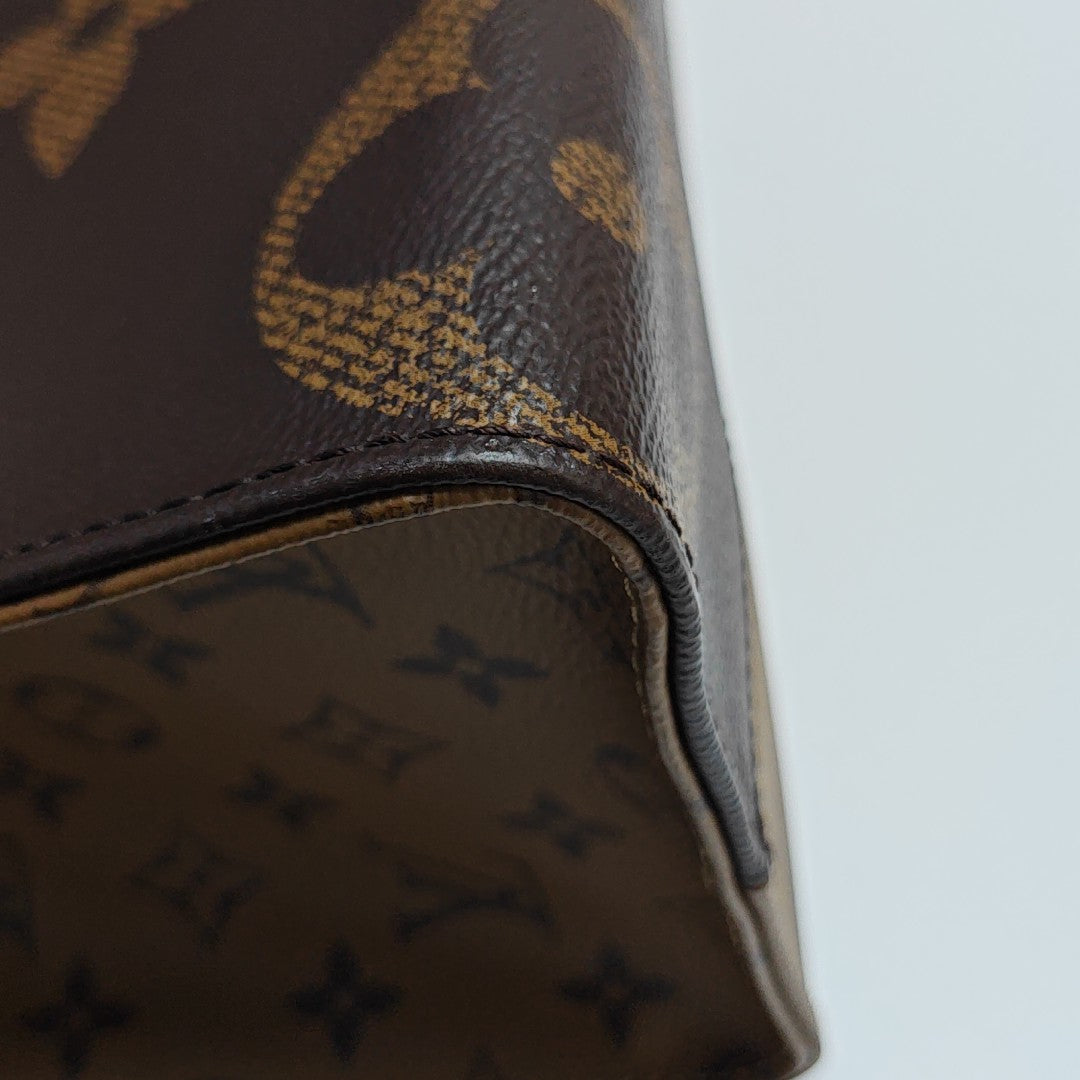 ONTHEGO MM Monogram Coated Canvas Brown