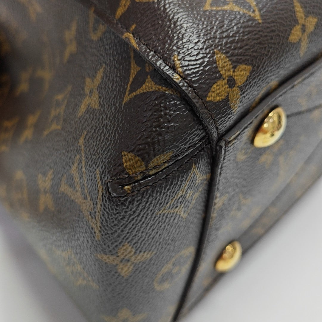 MONTAIGNE GM Monogram Coated Canvas Brown