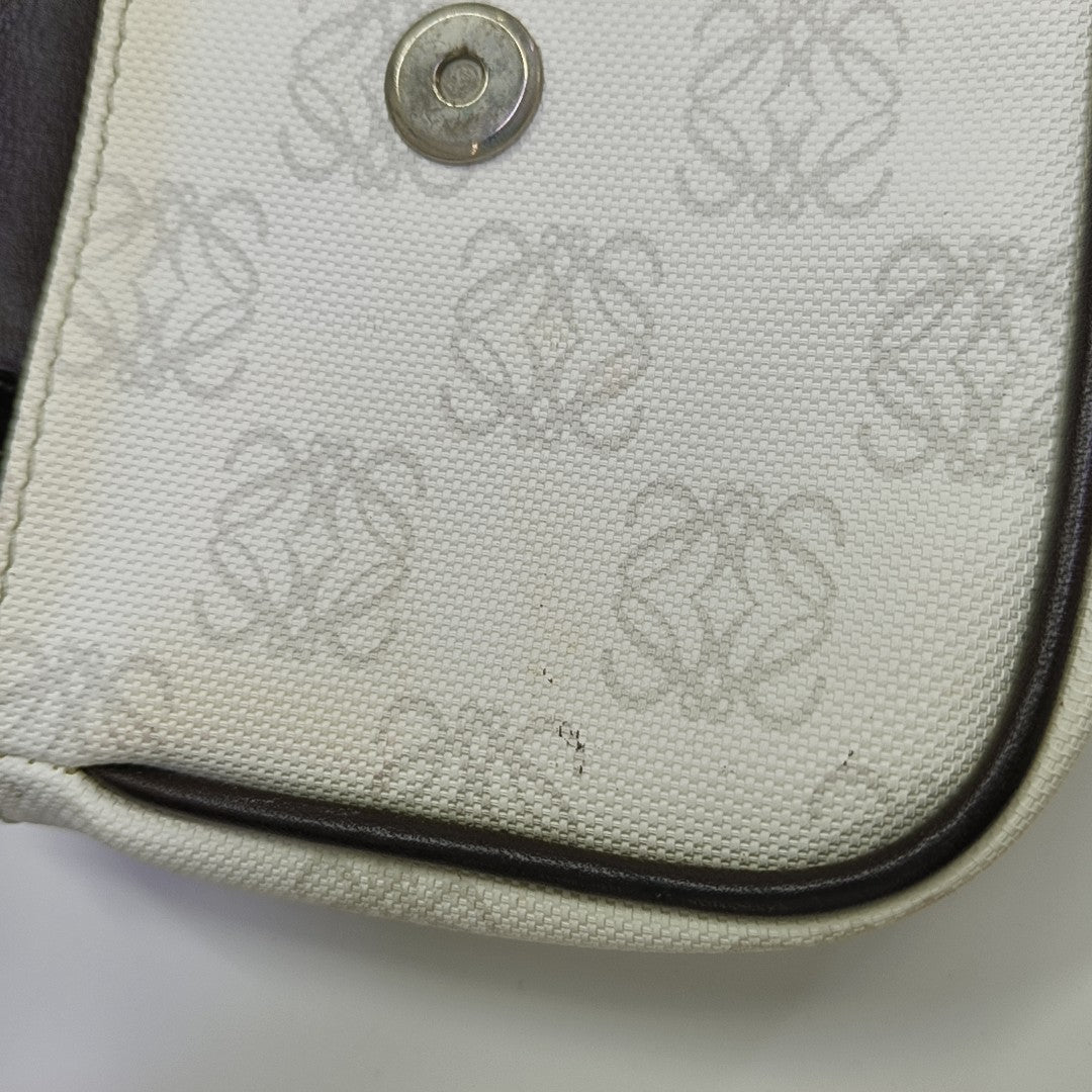 Monogram Coated Canvas Clutch White