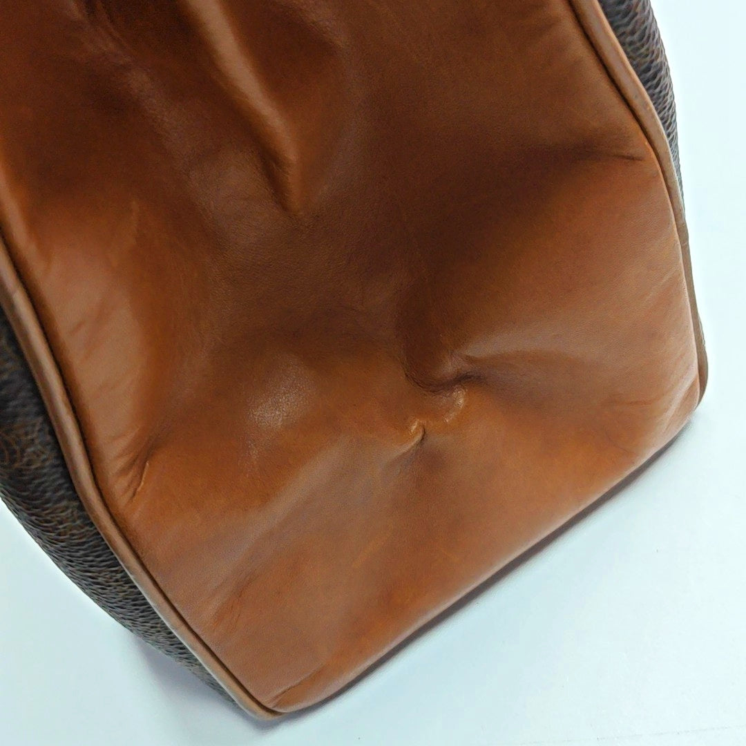 Authenticated pre-owned  MACADAM BLASON TRIOMPHE Coated Canvas Brown - Top Handle Bag at Looply