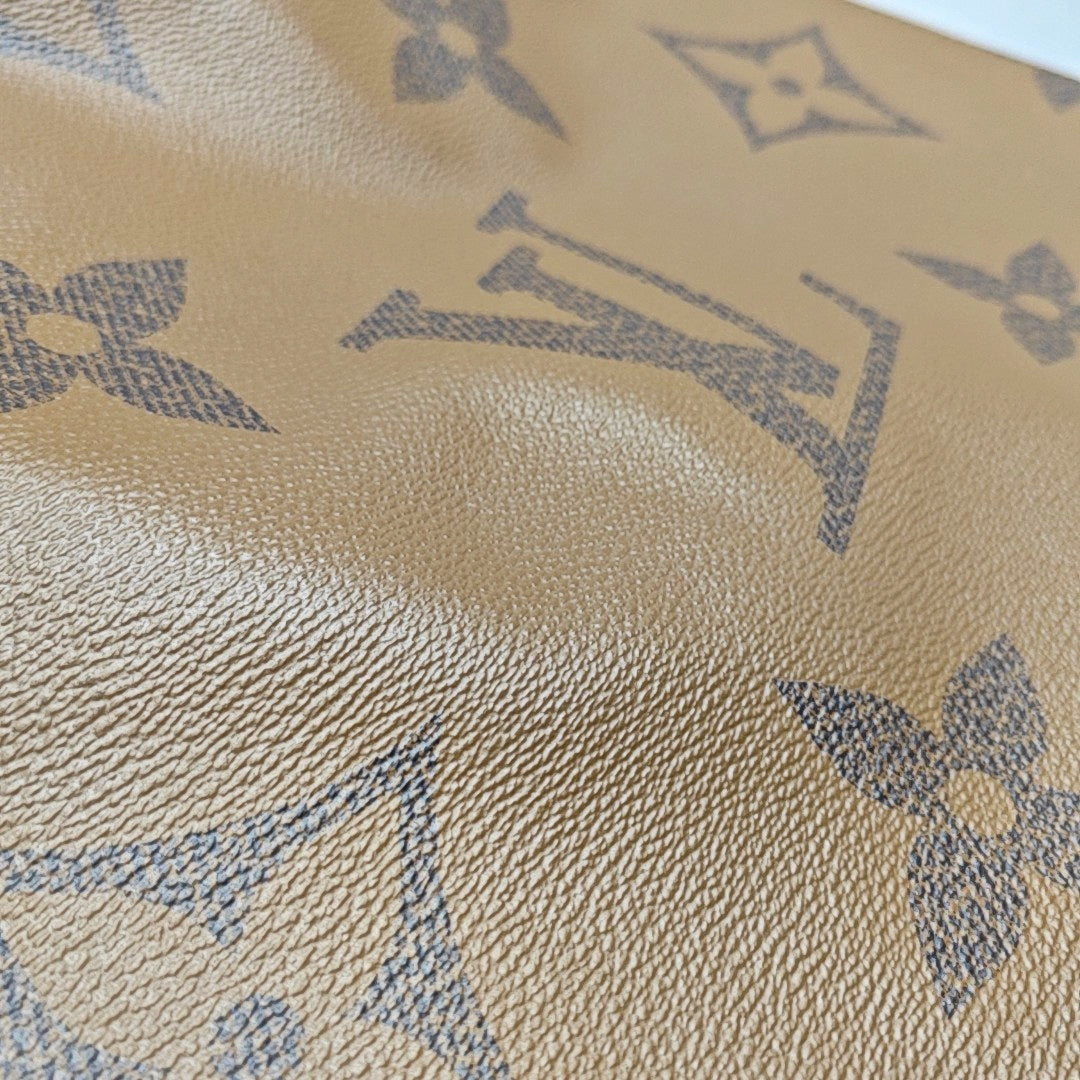 ONTHEGO GM Monogram Coated Canvas Brown