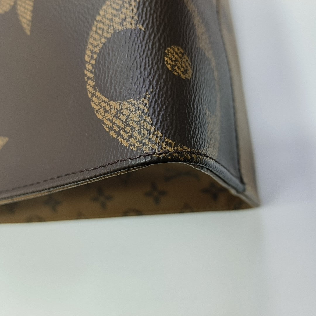 ONTHEGO MM Monogram Coated Canvas Brown
