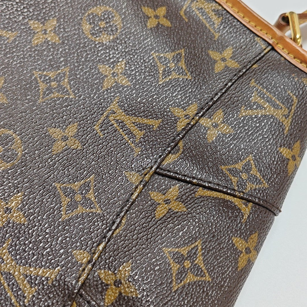 MENILMONTANT PM Monogram Coated Canvas Brown
