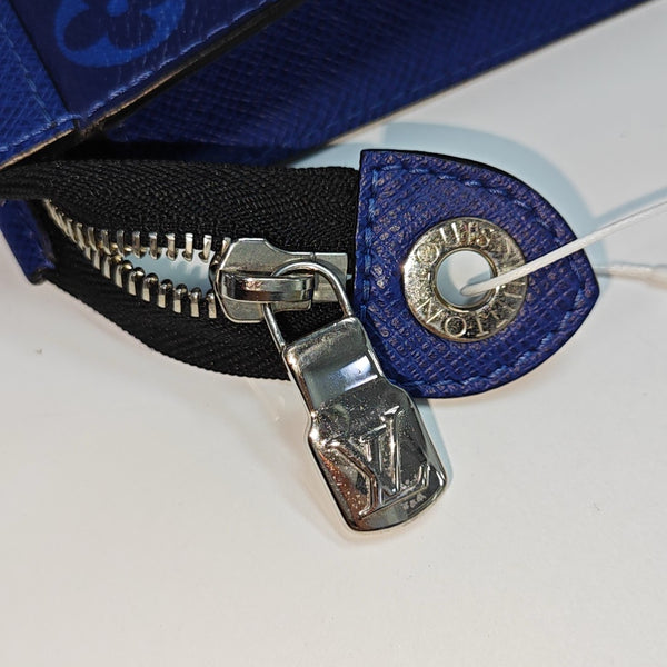 Pochette Voyag MM Monogram Coated Canvas Blue