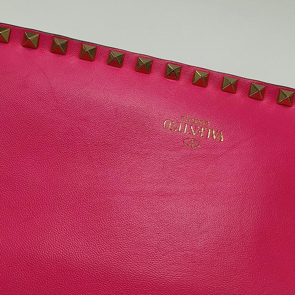 Authenticated pre-owned  Rockstud Lambskin Pink - Clutch at Looply