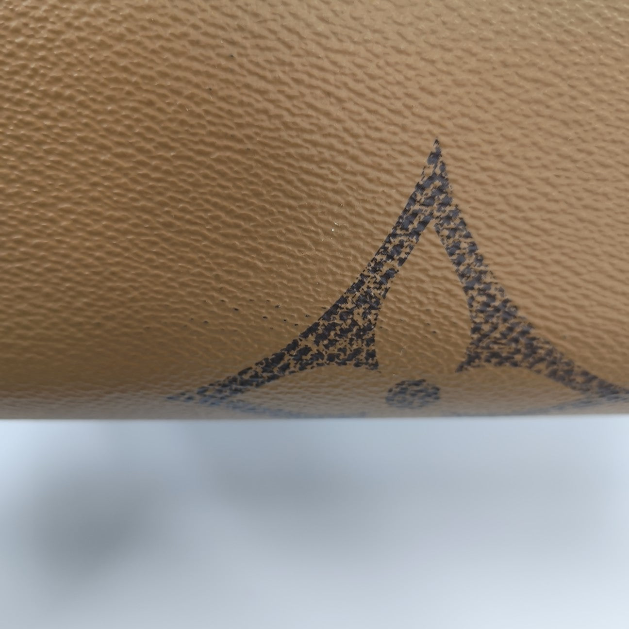 ONTHEGO MM Monogram Coated Canvas Brown