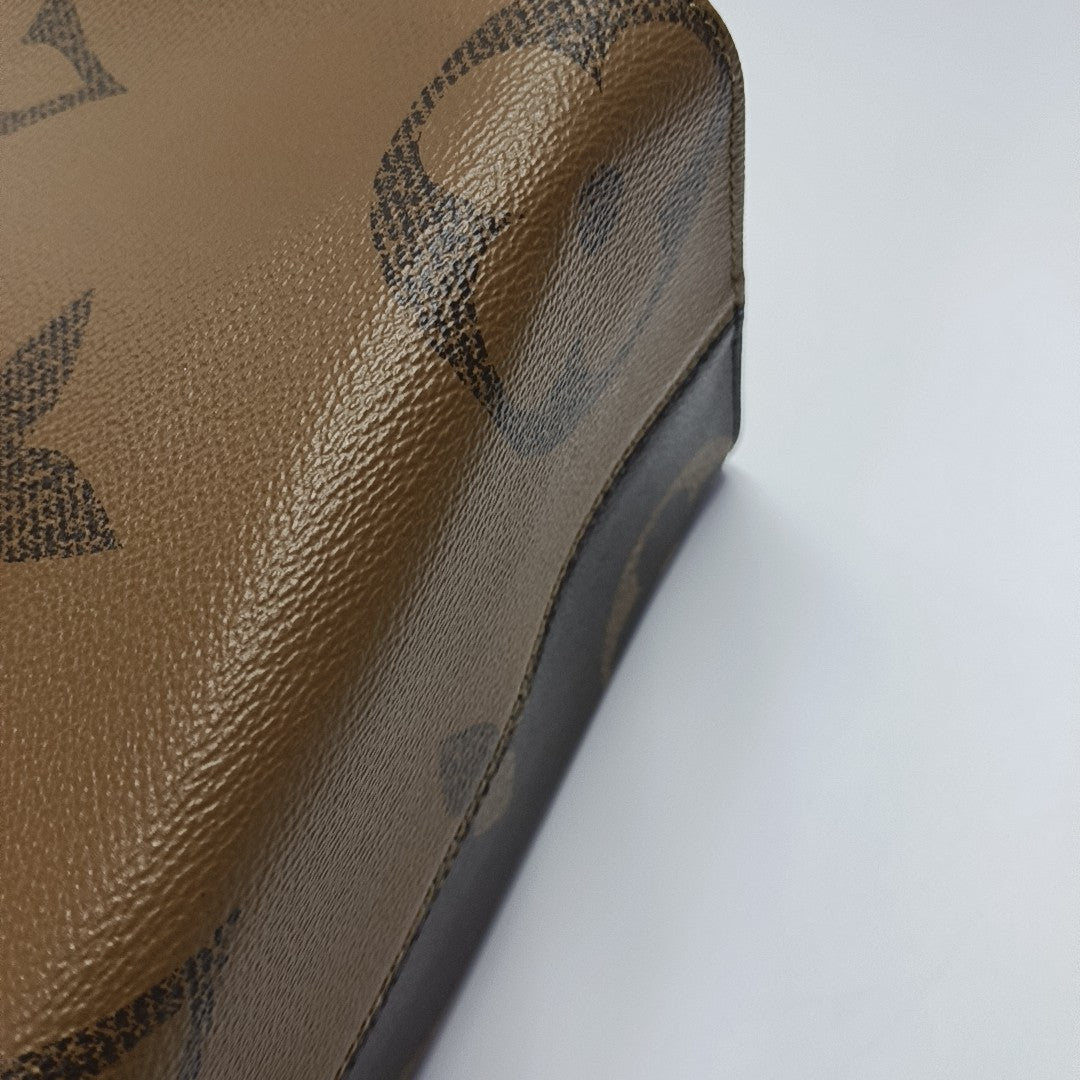ONTHEGO MM Monogram Coated Canvas Brown