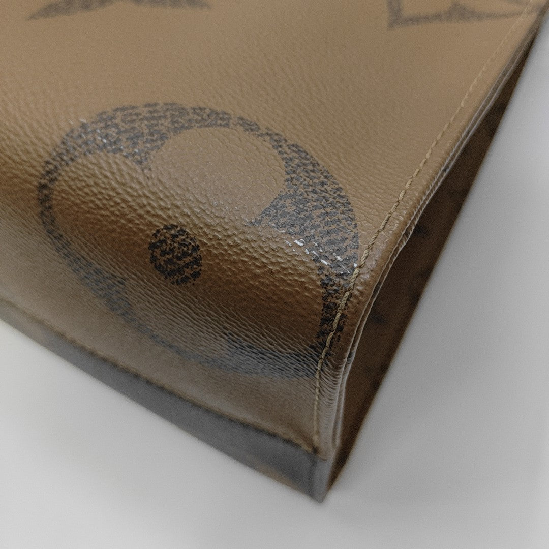 ONTHEGO MM Monogram Coated Canvas Brown