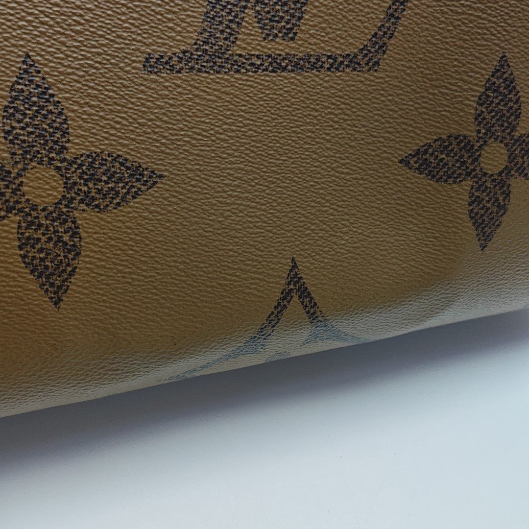ONTHEGO MM Monogram Coated Canvas Brown