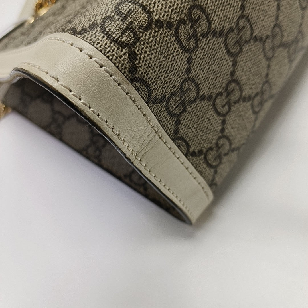 Padlock Small Monogram Coated Canvas Beige