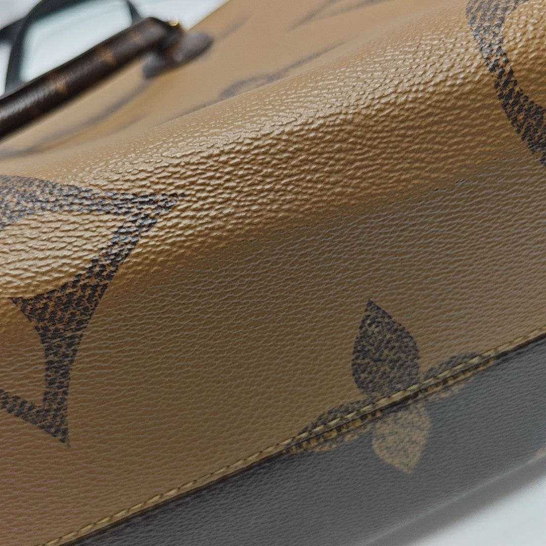 ONTHEGO MM Monogram Coated Canvas Brown