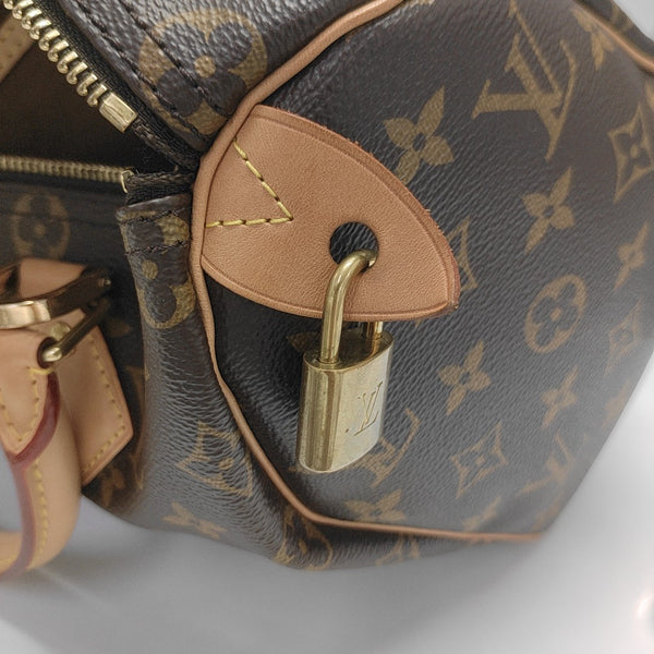 SPEEDY 25 Monogram Coated Canvas Brown