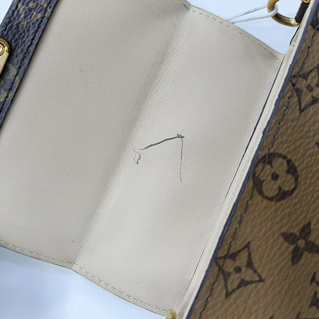 TRUNK Monogram Coated Canvas Brown