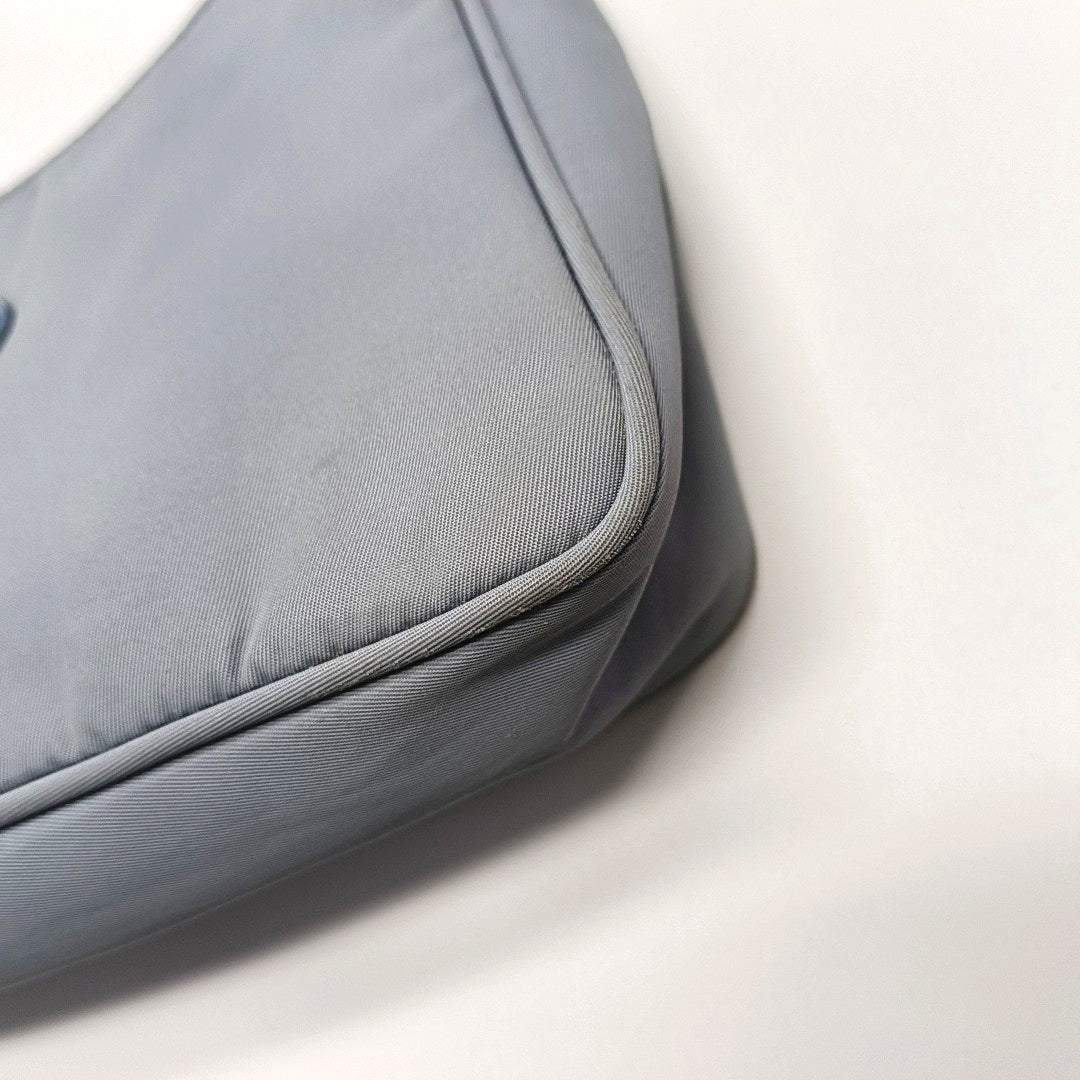 Authenticated pre-owned  Re-Edition2000 Nylon Blue - Top Handle Bag at Looply