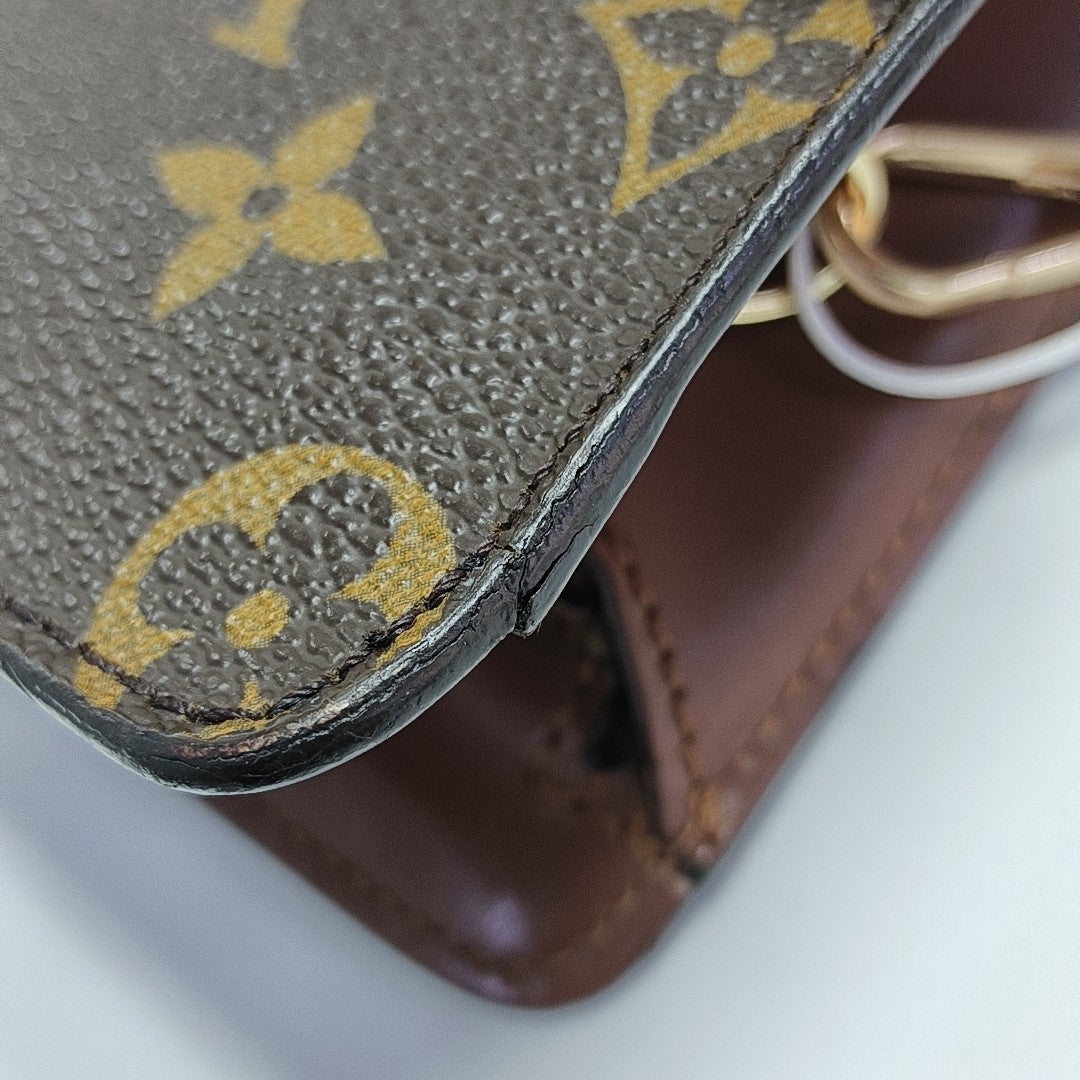 Monogram Coated Canvas Clutch Brown